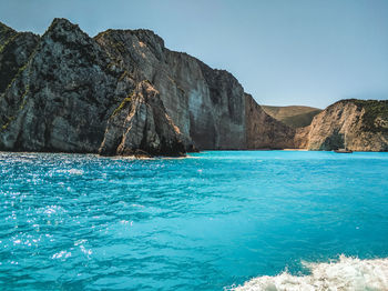 Scenic view of sea against clear blue sky