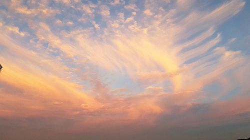 Low angle view of dramatic sky during sunset