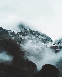 Low angle view of waterfall against sky