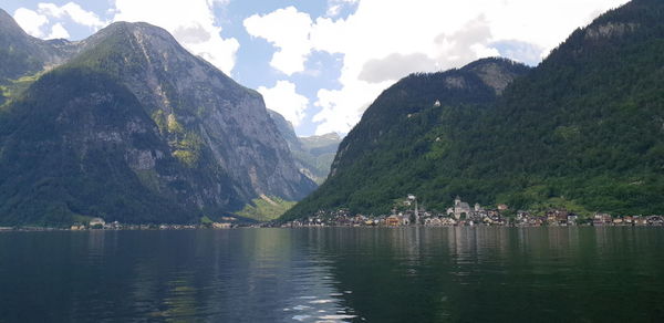 Scenic view of lake and mountains against sky