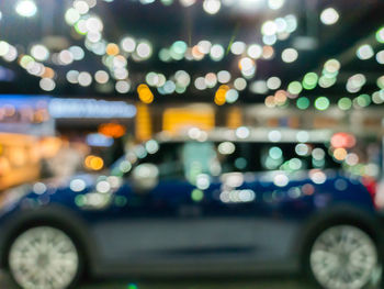 Defocused image of illuminated city at night