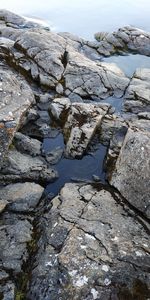 High angle view of rocks in river during winter