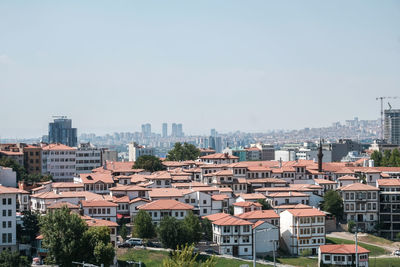 High angle view of buildings in city against sky