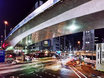Illuminated city street at night