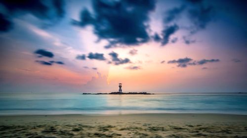 Scenic view of beach at sunset