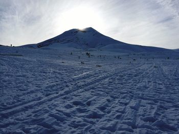 Scenic view of snow mountains against sky