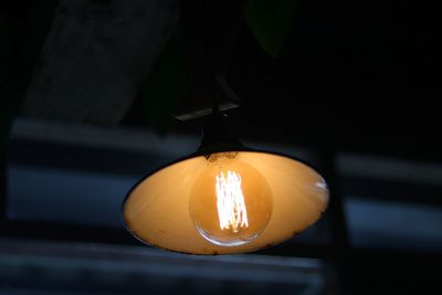 Close-up of illuminated light bulb