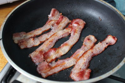 Close-up of meat in cooking pan