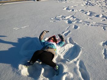 High angle view of woman in snow