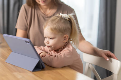 Young woman using laptop at home