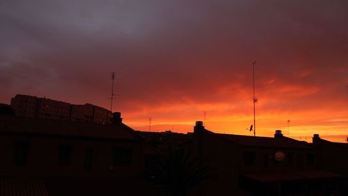 Low angle view of building against sky at sunset