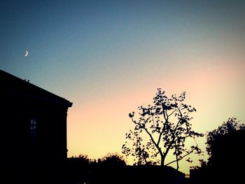 Low angle view of building against sky at dusk