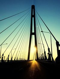 Low angle view of silhouette bridge against sky during sunset