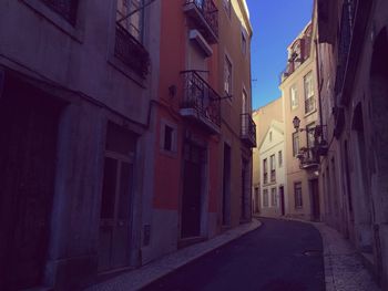 Street amidst buildings against sky