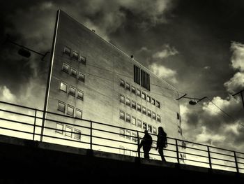 Low angle view of building against cloudy sky