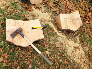 High angle view of cross on tree stump