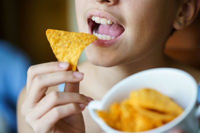 Close-up of woman holding food