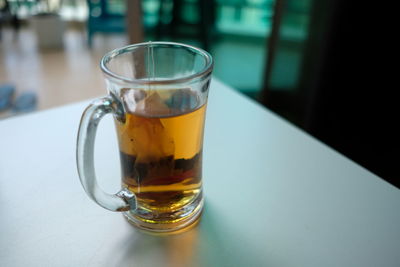 Close-up of tea in glass on table