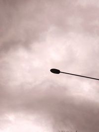 Low angle view of street light against sky