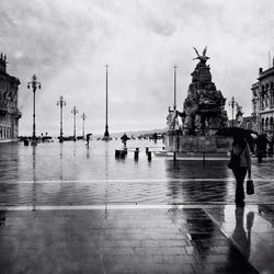 People in front of sea against sky