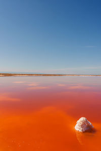 Scenic view of sea against clear sky during sunset