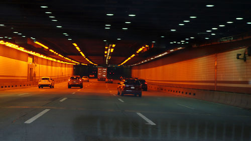 Cars in illuminated parking lot