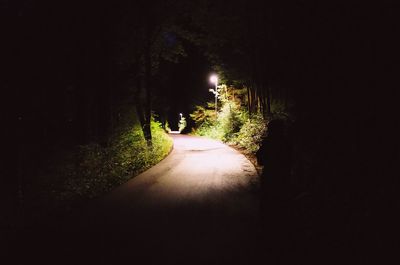 Walkway in illuminated tunnel