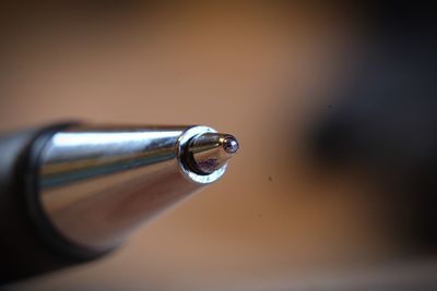 Close-up of metal on table