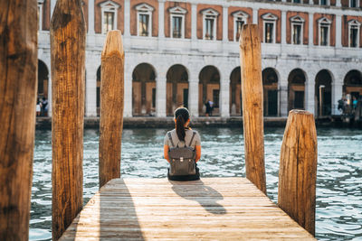 Tourist on jetty in venice