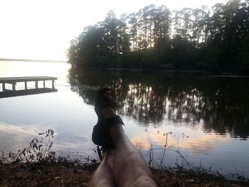 Scenic view of lake with trees in background