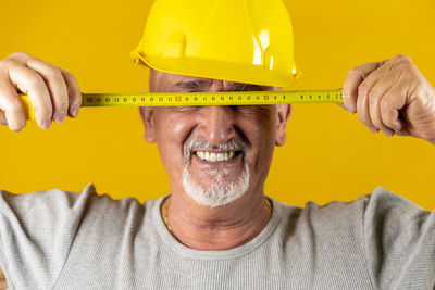 Midsection of man working in hat