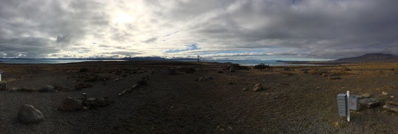 Scenic view of landscape against cloudy sky