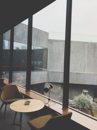 High angle view of empty chairs and tables in restaurant
