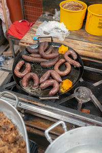 High angle view of meat on barbecue grill