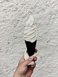 Hand holding ice cream cone