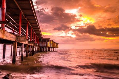 Scenic view of sea against orange sky