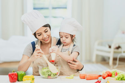 Midsection of woman preparing food