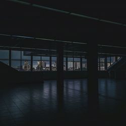 Reflection of building on tiled floor