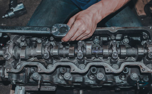 Cropped hand of man working at workshop