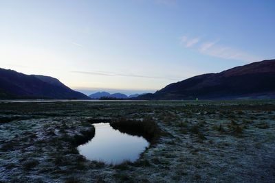 Scenic view of lake against sky during sunset