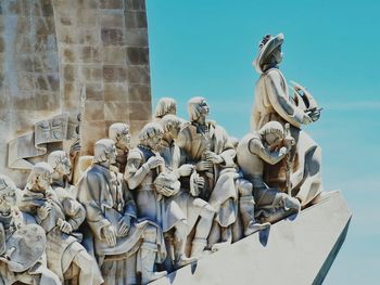 Low angle view of statue against building