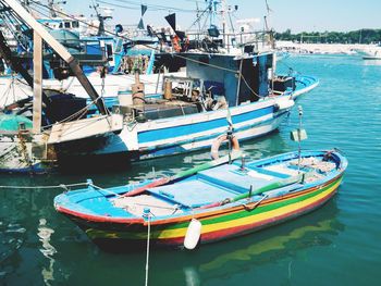 High angle view of fishing boats moored at harbor