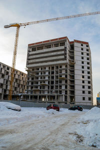 Buildings against sky during winter