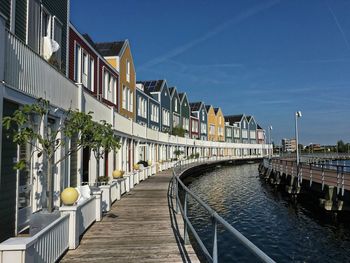 Bridge in city against sky