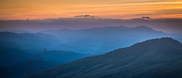 Scenic view of mountains against sky during sunset