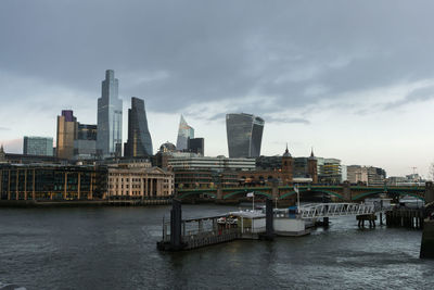 View of london's city centre and the thames river at sunset