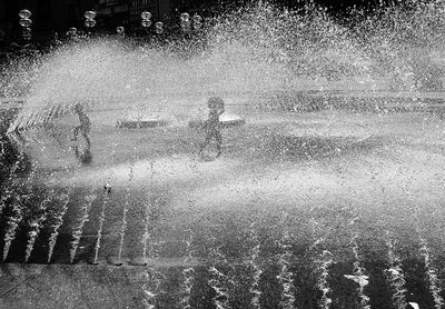 Water splashing on fountain in city