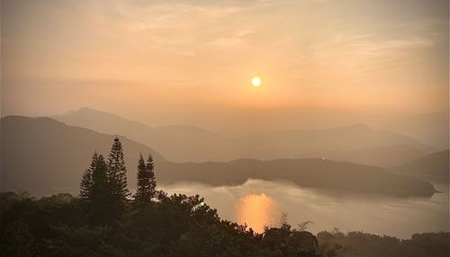 Scenic view of mountains against sky during sunset