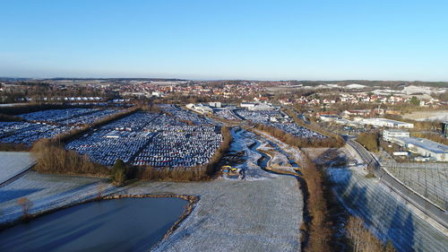 High angle view of cityscape against blue sky