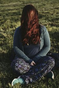 Woman sitting on grass